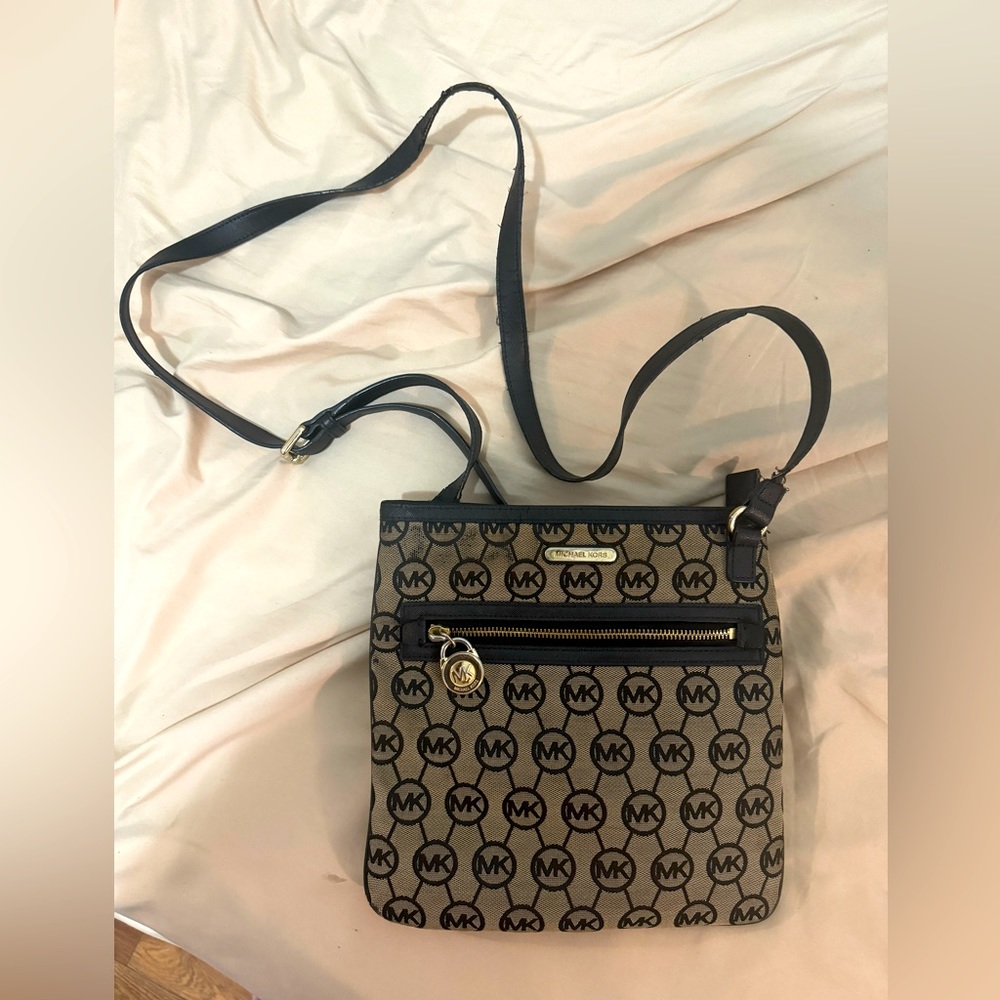 Michael Kors Crossbody bag with the MK circle logo all over bag.